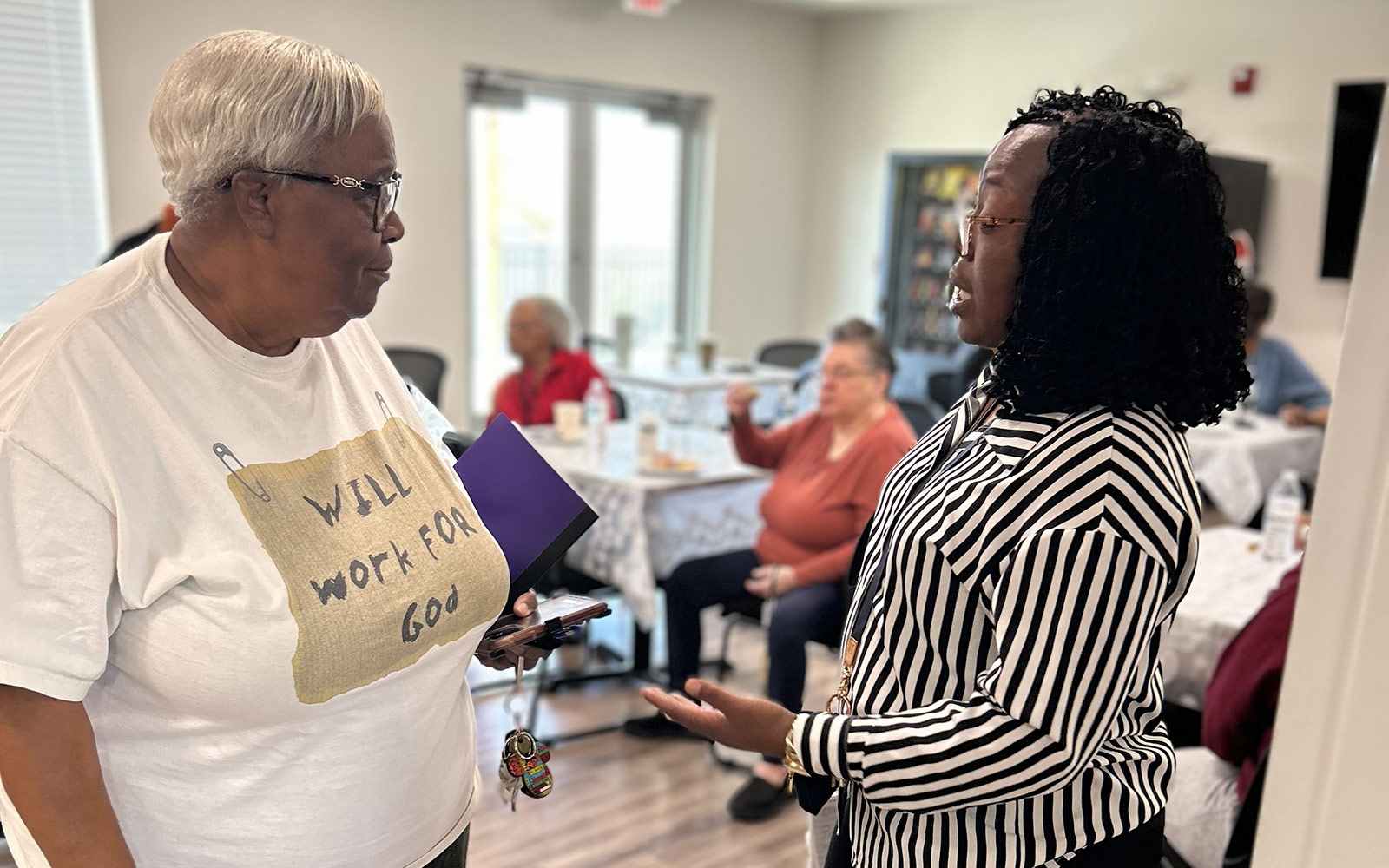 A resident meeting with a Phoenix Family staff member