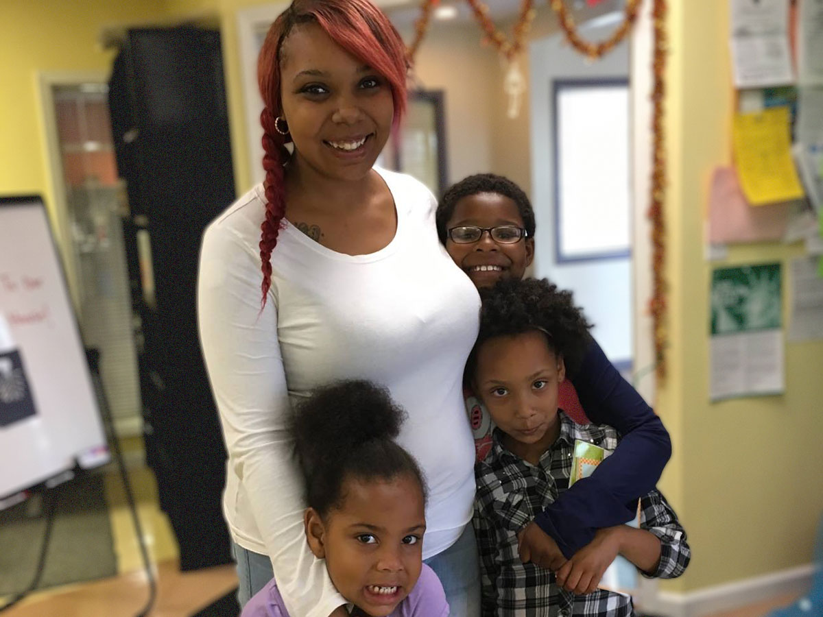 Danielle, a parent raising two children, in her apartment community